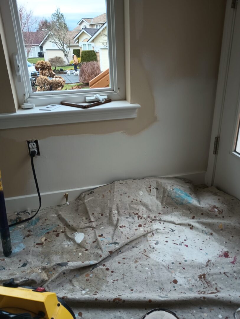 A room with the floor covered in paper and debris.