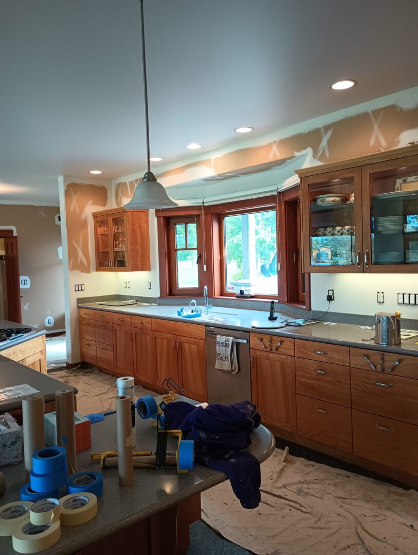 A kitchen with wooden cabinets and a table